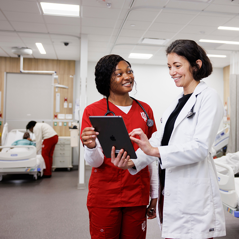 IU School of Nursing faculty member Samantha Eades instructs a student.