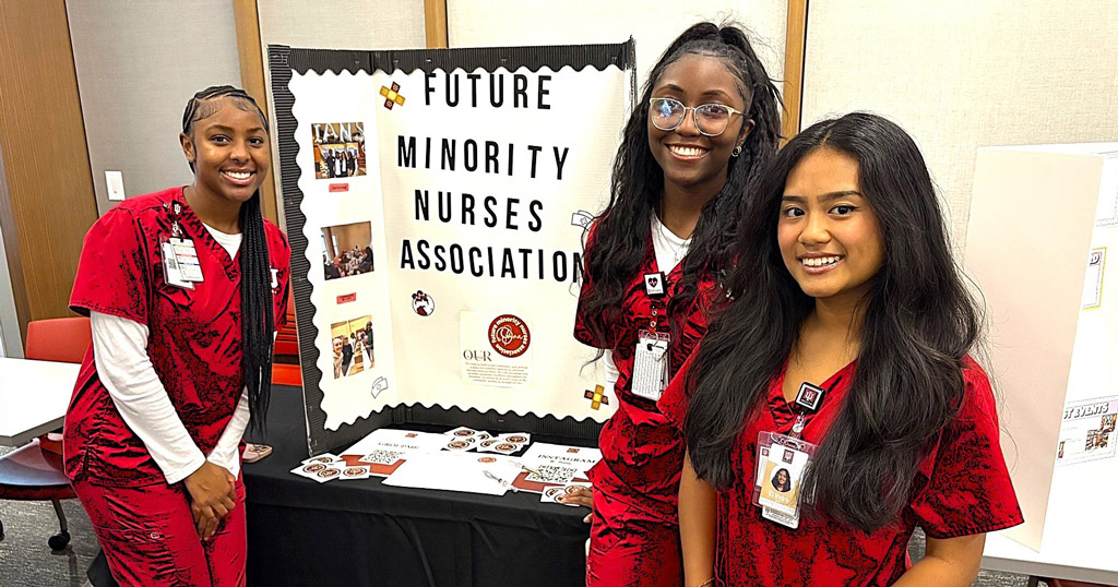 Nursing students Jaila Crawford, Zion Nelson, and Indra Soe host an information table at the Health Sciences Building Open House