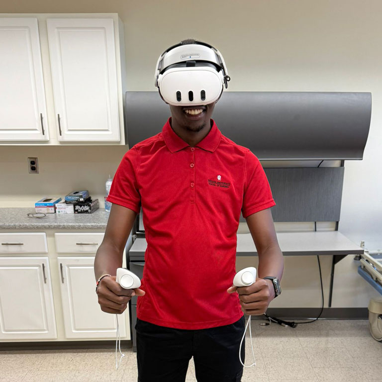 Moi University student Dancan Kirabi uses virtual-reality goggles during a nursing simulation training.