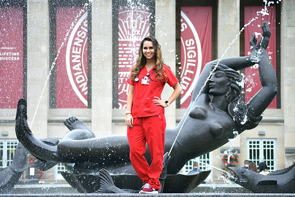 Mary Jancovich stands in front of Showalter Fountain at IU Bloomington.