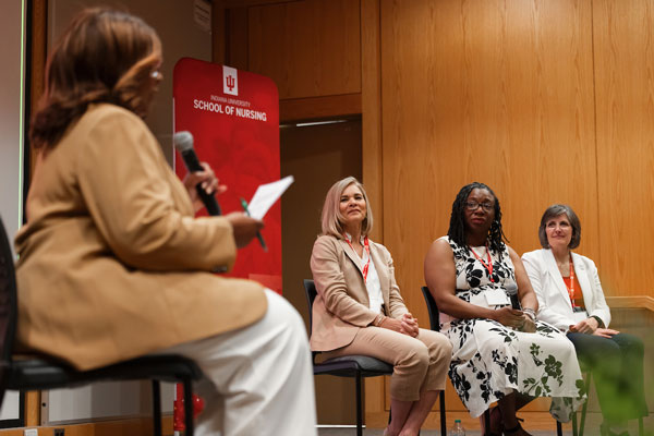 Sandra Chapman speaks during a Policy Academy panel while Dr. Kristin Ashford, Toni Tipton, and Dr. Janet S. Carpenter look on.