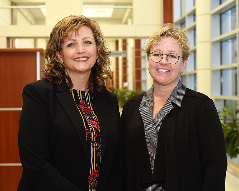 Faculty Angela Opsahl and Amy Hagedorn Wonder smiling for camera