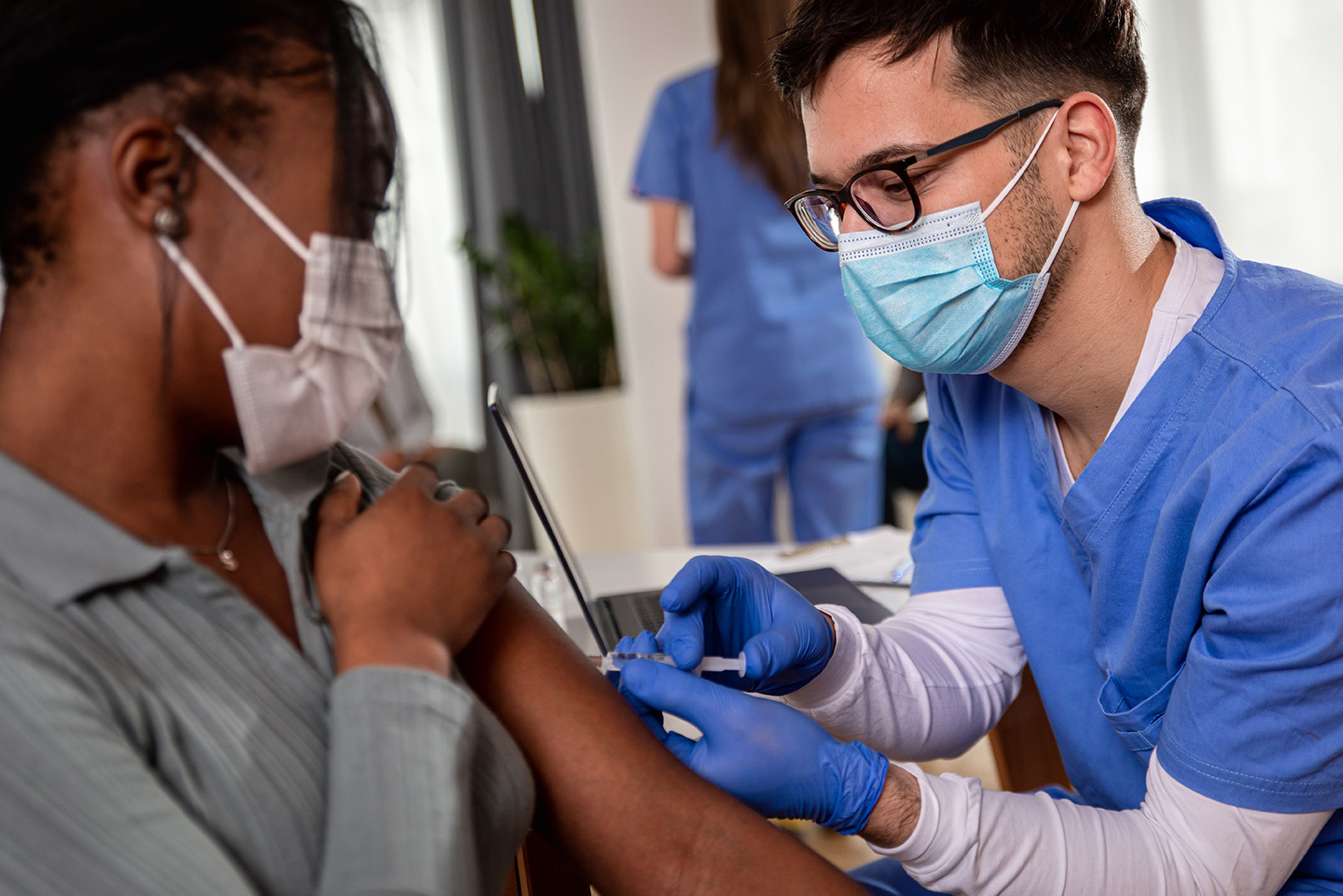 A healthcare worker with client